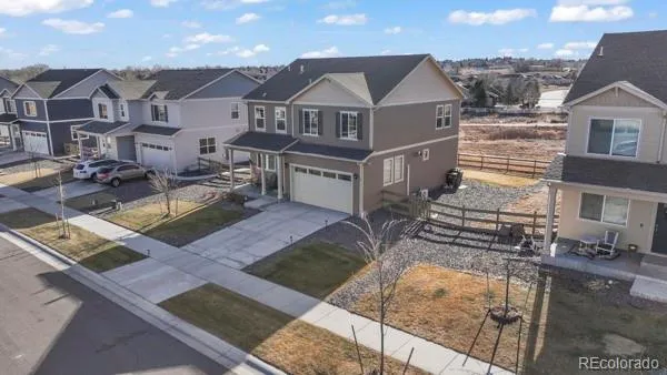 an aerial view of a house with swimming pool