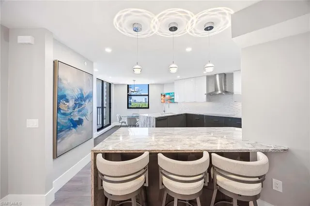 a kitchen with a table and chairs