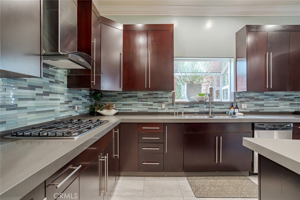 12945 Calvert Street Van Nuys, CA 91401 - Photo 11 of 57 a kitchen with stainless steel appliances granite countertop a sink and cabinets