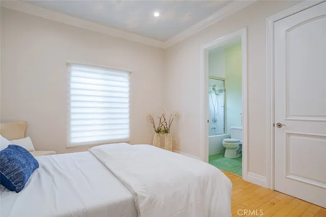 a spacious bedroom with a large bed and a couch