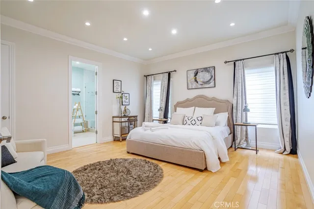 a bedroom with a large bed and a window