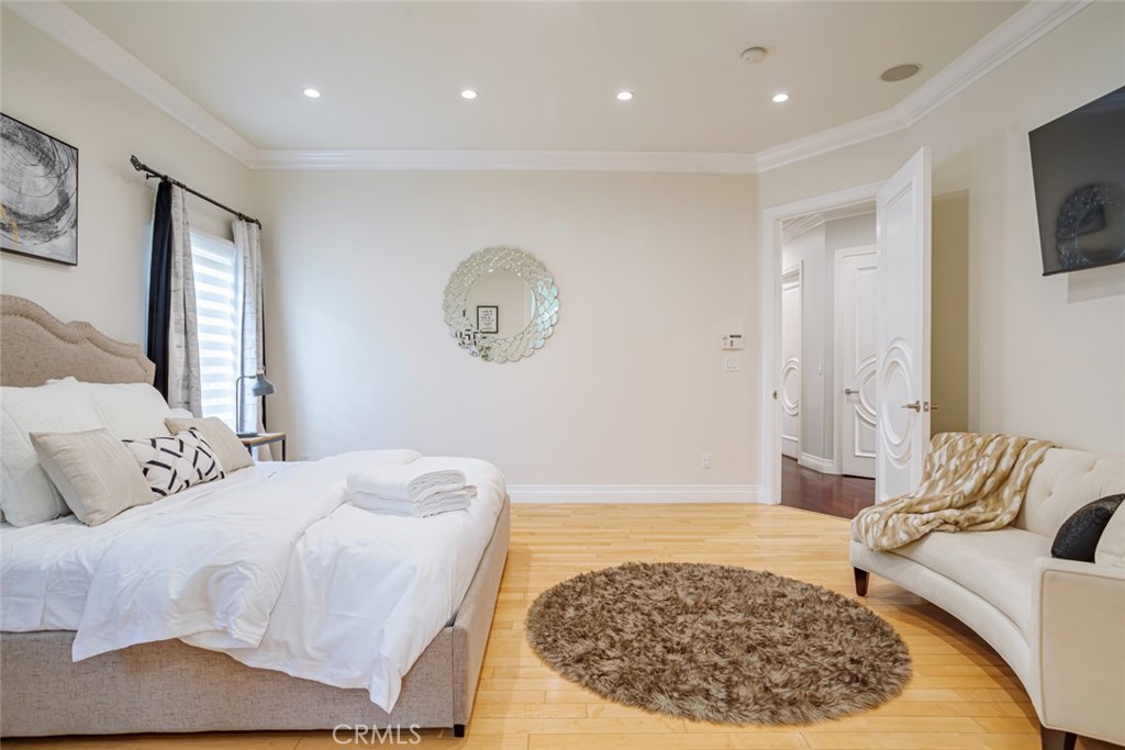 12945 Calvert Street Van Nuys, CA 91401 - Photo 18 of 57 a living room with a bed and a couch