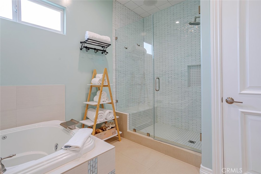 12945 Calvert Street Van Nuys, CA 91401 - Photo 20 of 57 a bathroom with a sink and a shower