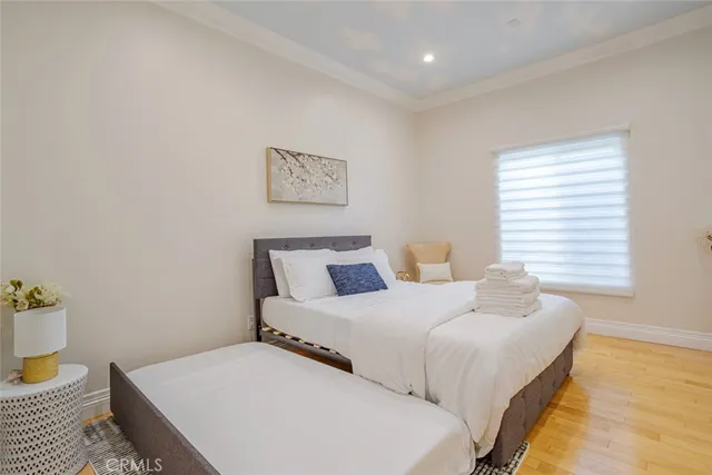 a bedroom with a large bed and a window