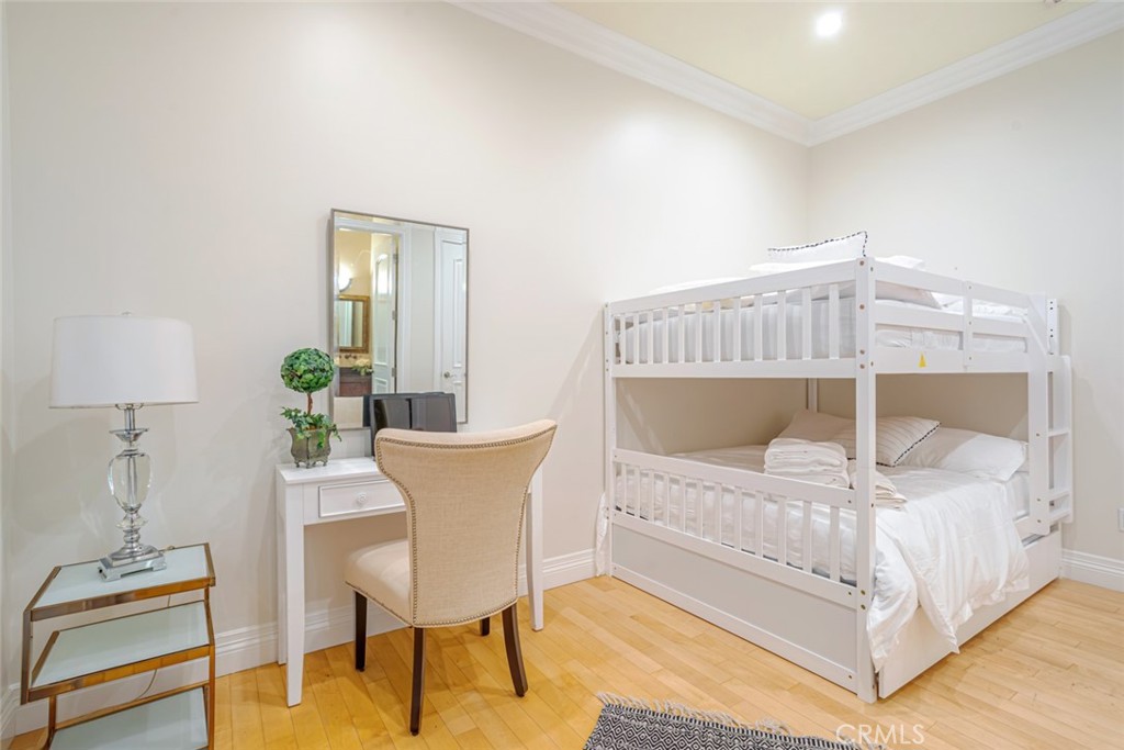 12945 Calvert Street Van Nuys, CA 91401 - Photo 33 of 57 a bedroom with a bed and a table in it