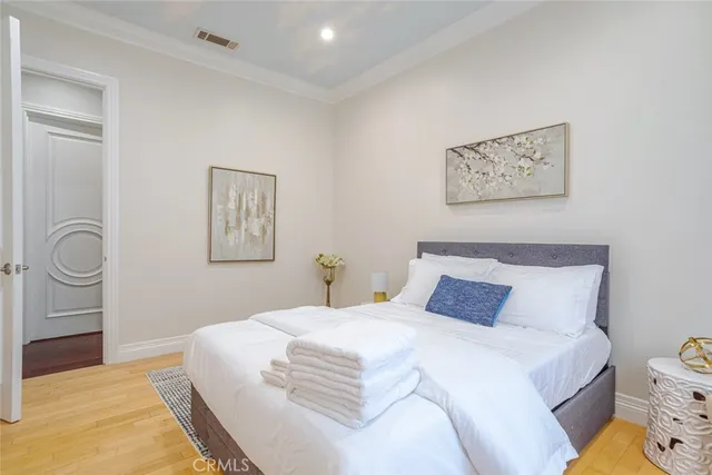 a bedroom with a bed and chair