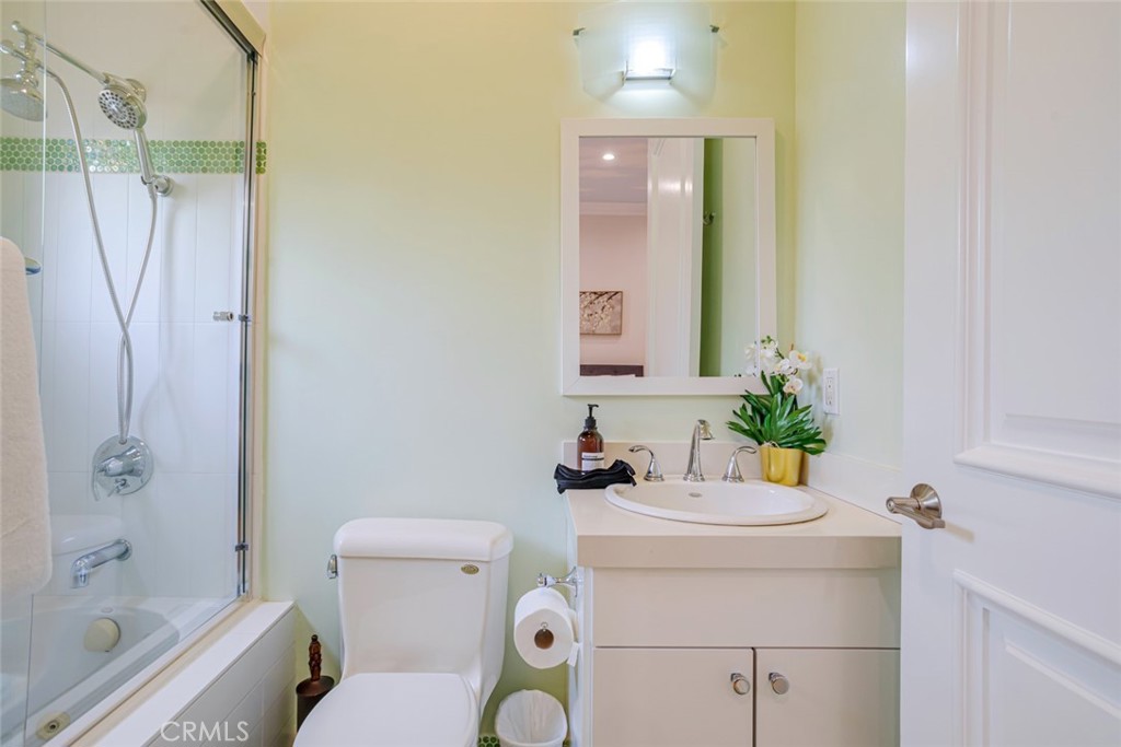 12945 Calvert Street Van Nuys, CA 91401 - Photo 37 of 57 a bathroom with a sink toilet and shower