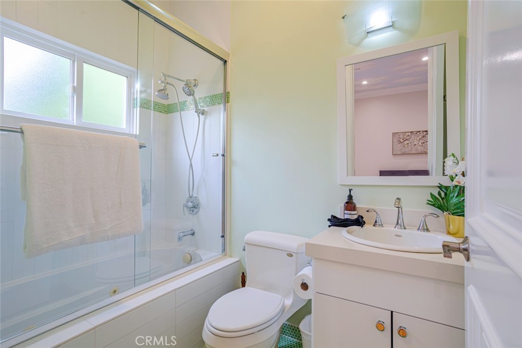 12945 Calvert Street Van Nuys, CA 91401 - Photo 38 of 57 a bathroom with a sink a toilet and shower