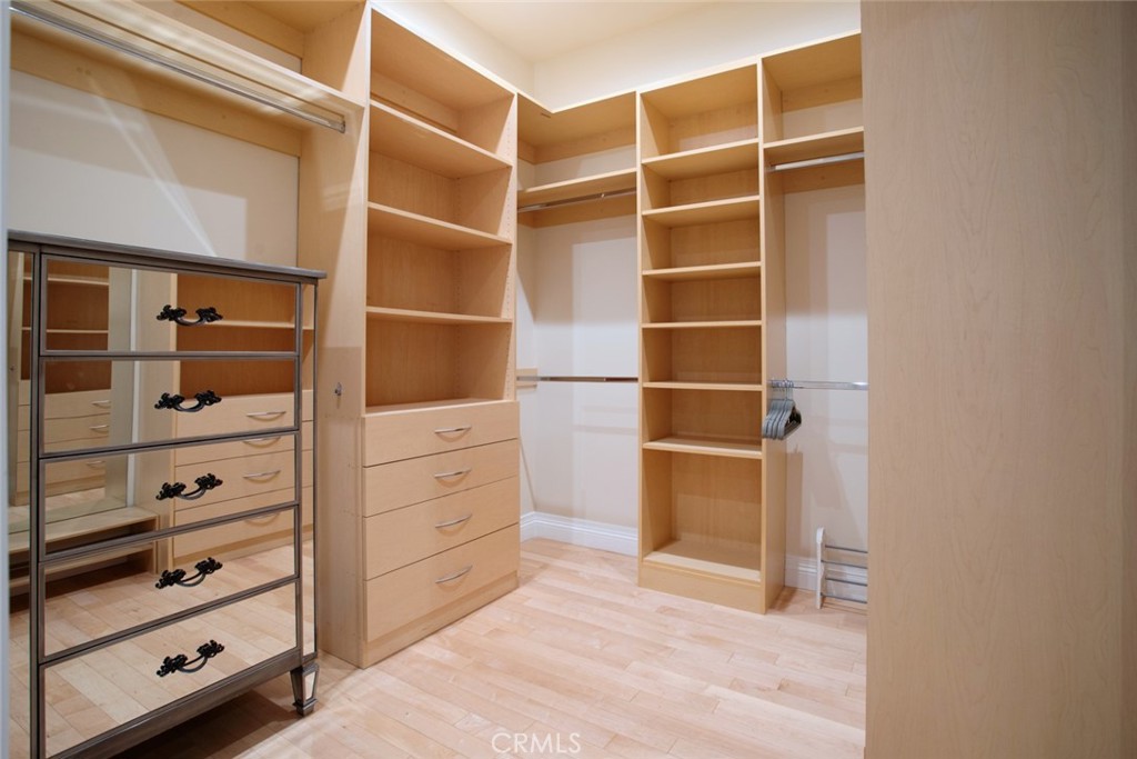 12945 Calvert Street Van Nuys, CA 91401 - Photo 41 of 57 a view of walk in closet with empty racks