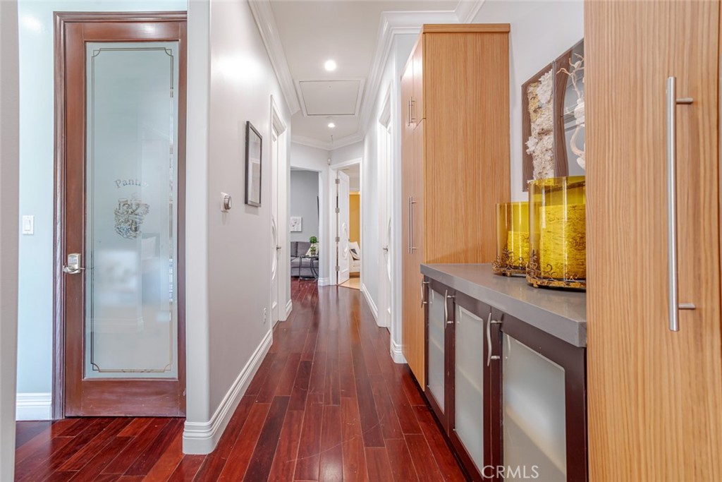 12945 Calvert Street Van Nuys, CA 91401 - Photo 44 of 57 a view of a hallway with wooden floor