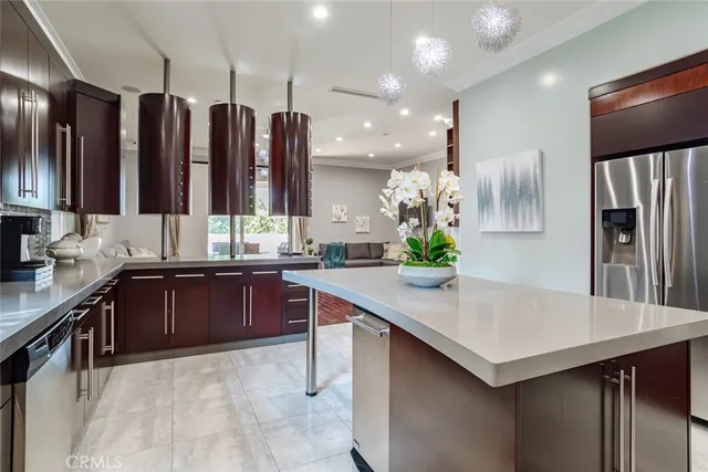 a kitchen with stainless steel appliances granite countertop a sink and cabinets
