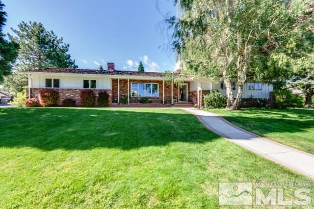 2000 Regent Street Reno, NV 89509 - Photo 1 of 1 a view of a house with a big yard and large trees