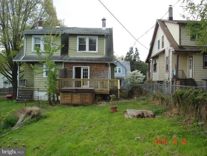 420 Walcott Road Baltimore, MD 21206 - Photo 2 of 11 a backyard of a house with table and chairs