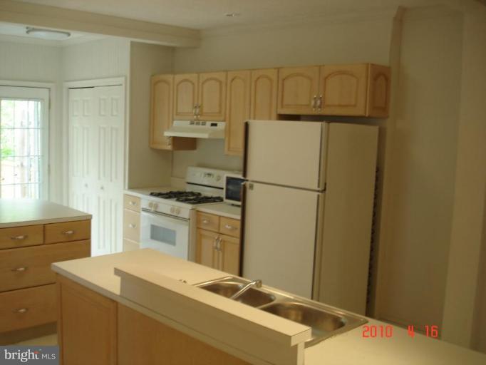 420 Walcott Road Baltimore, MD 21206 - Photo 5 of 11 a room with storage and utility