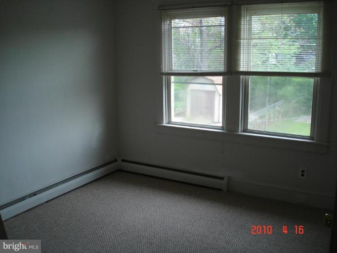 420 Walcott Road Baltimore, MD 21206 - Photo 10 of 11 an empty room with a window