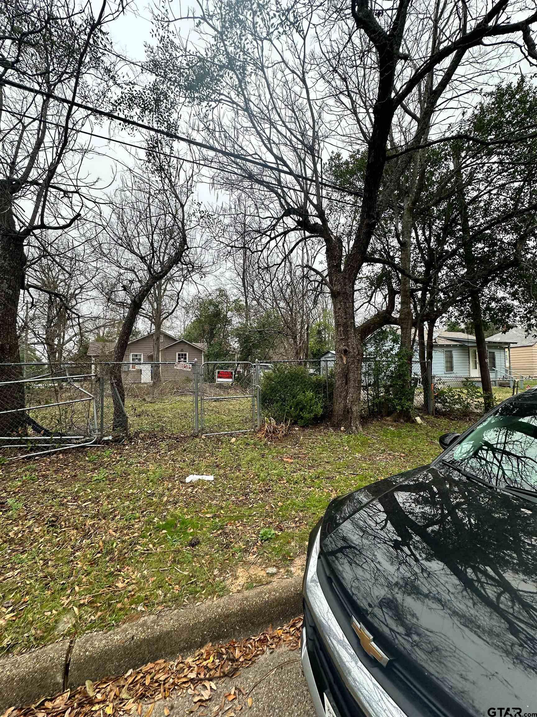 1103 South Academy Avenue Tyler, TX 75701 - Photo 2 of 7 a view of a yard with large tree