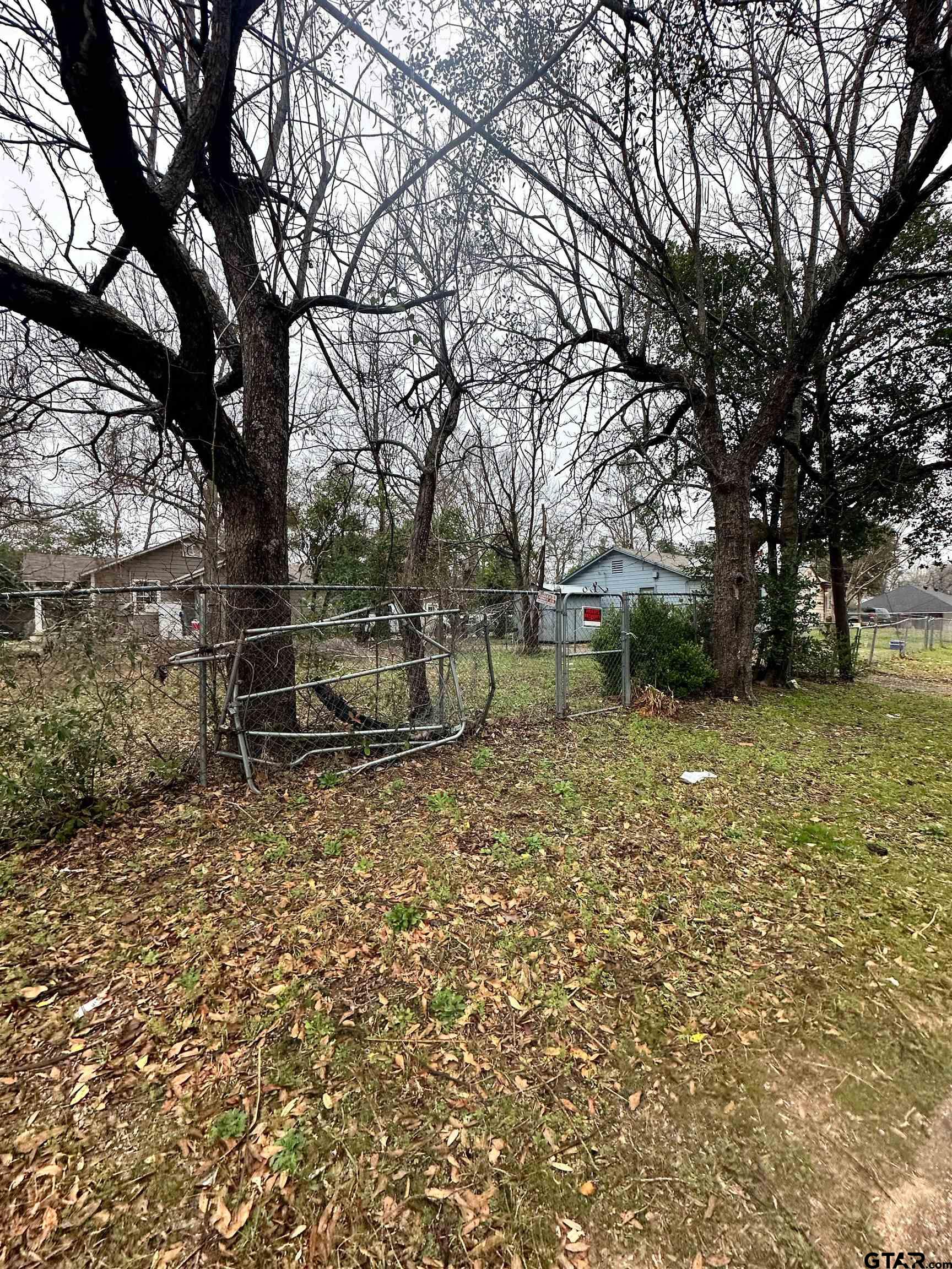 1103 South Academy Avenue Tyler, TX 75701 - Photo 3 of 7 a backyard of a house with lots of green space