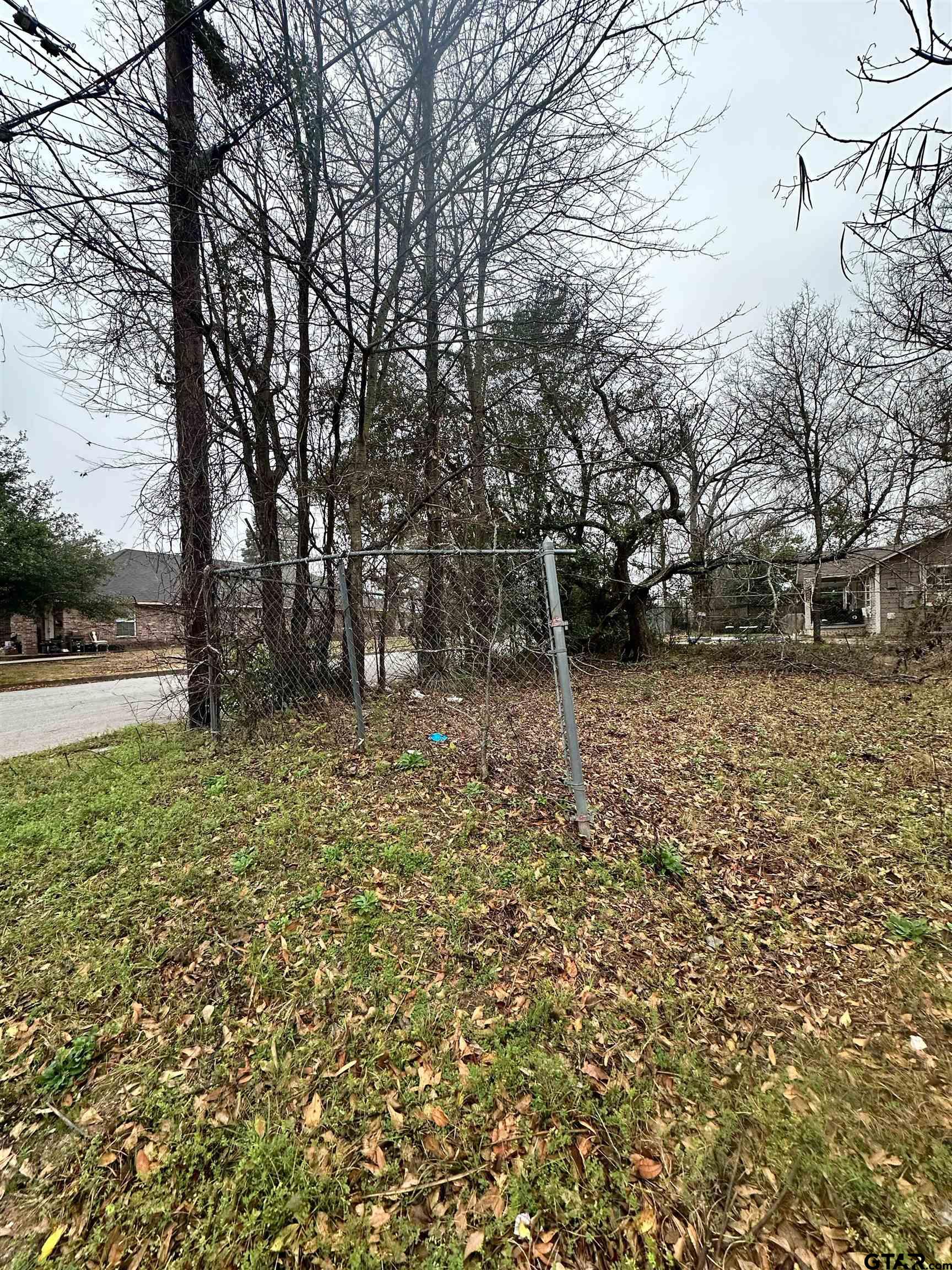 1103 South Academy Avenue Tyler, TX 75701 - Photo 5 of 7 a backyard of a house with lots of green space