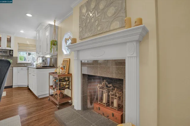 a kitchen with cabinets and a wooden floor