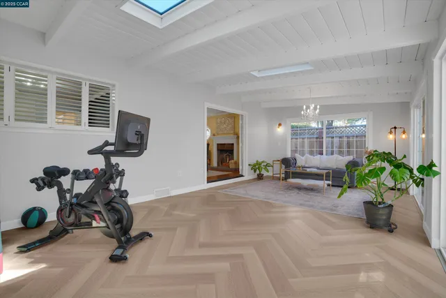 a view of a livingroom with furniture and a potted plant