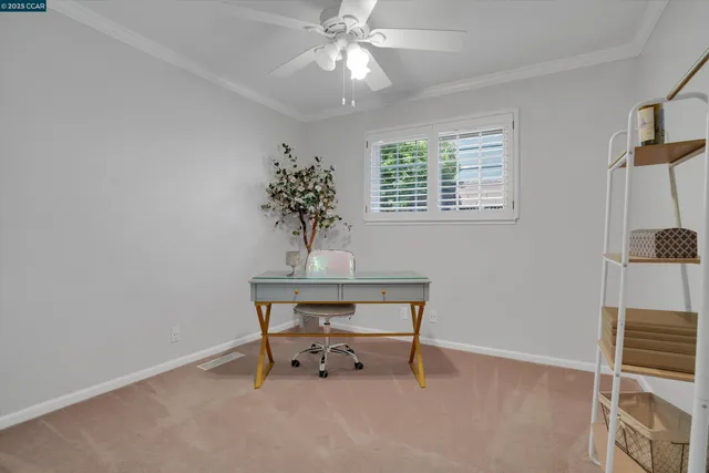 a view of workspace with a table and chairs