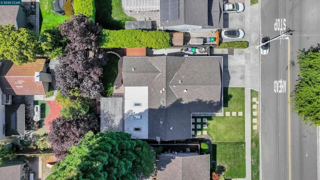 an aerial view of a house with a yard