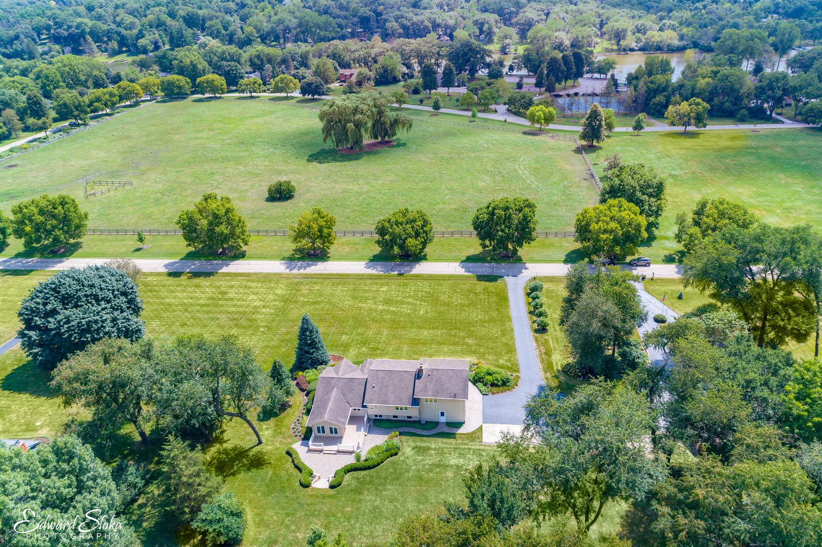 288 Fox Harbor Road Trout Valley, IL 60013 - Photo 2 of 34 an aerial view of a residential houses with outdoor space and lake view in back