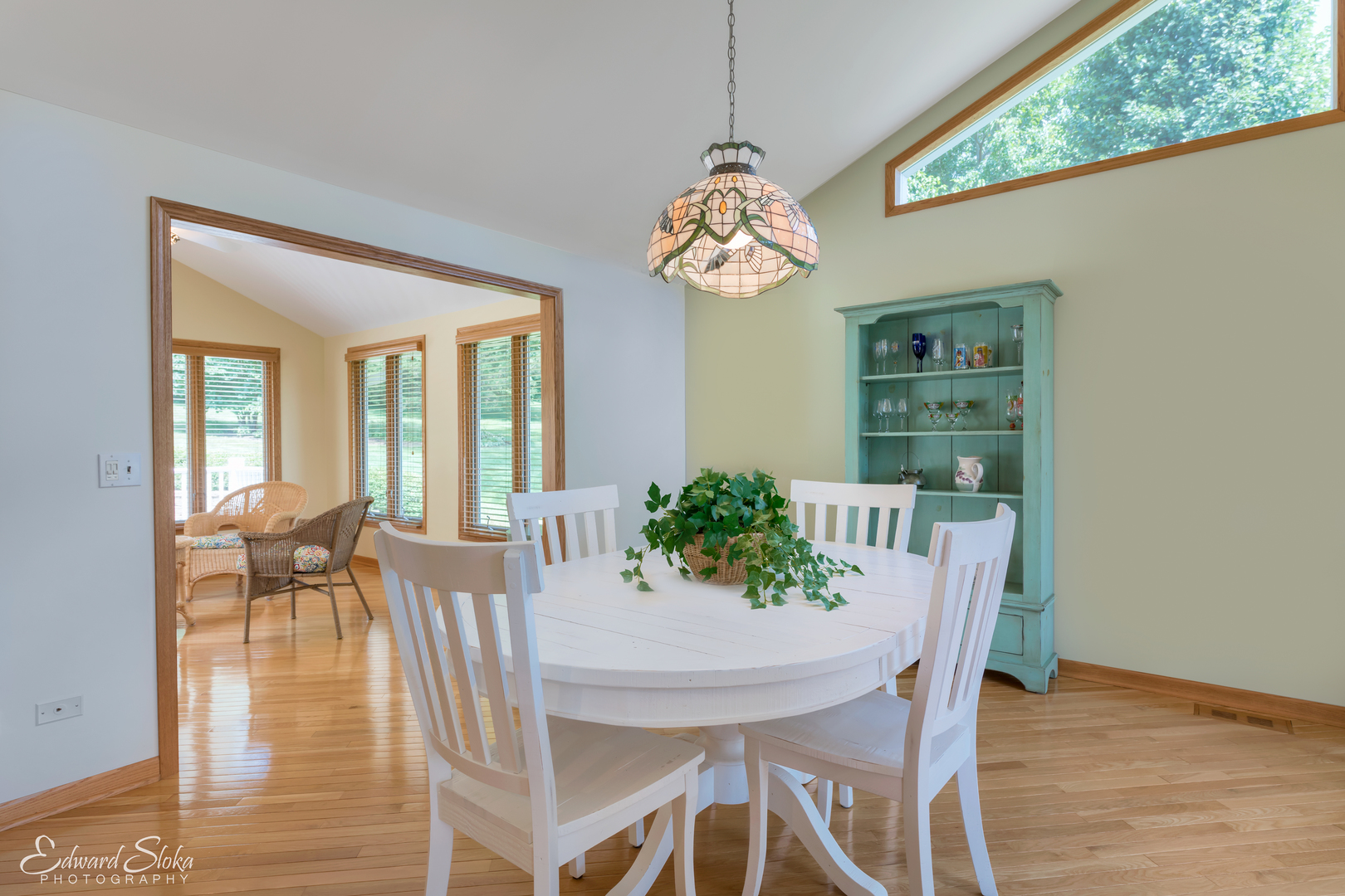 288 Fox Harbor Road Trout Valley, IL 60013 - Photo 11 of 34 a view of a dining room with furniture wooden floor and chandelier