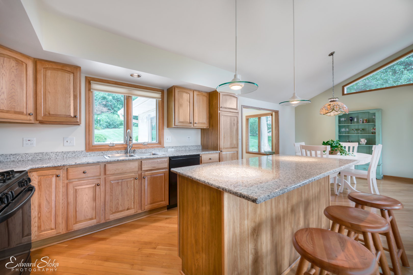 288 Fox Harbor Road Trout Valley, IL 60013 - Photo 7 of 34 a kitchen with center island table and chairs in it