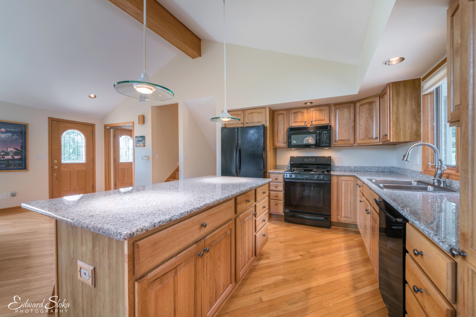 288 Fox Harbor Road Trout Valley, IL 60013 - Photo 9 of 34 a kitchen with stainless steel appliances granite countertop a kitchen island a stove a sink and a refrigerator