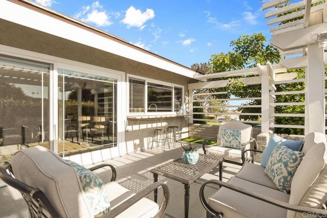 a view of a porch with furniture