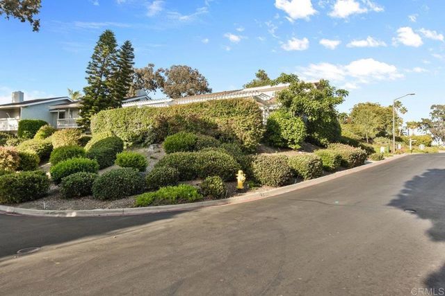 a view of a balcony with chairs