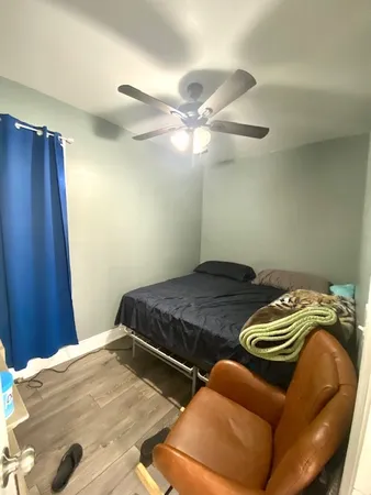 a bathroom with a sink a toilet a mirror and shower