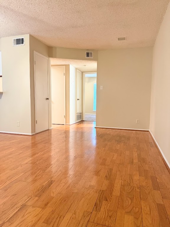202 East 45th Street, Unit 306 Austin, TX 78751 - Photo 4 of 11 a view of an empty room with wooden floor