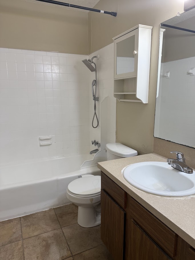 202 East 45th Street, Unit 306 Austin, TX 78751 - Photo 6 of 11 a bathroom with a sink toilet and shower