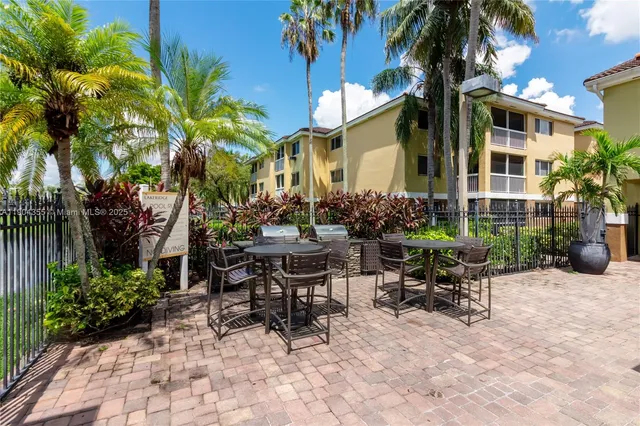 a view of an outdoor sitting area with furniture