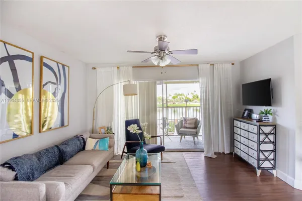 a bedroom with a bed dresser and a window