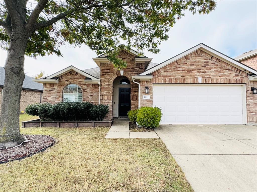 1111 Mount Olive Lane Forney, TX 75126 - Photo 1 of 15 a view of a house with a yard and potted plants