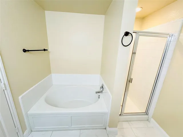 a bathroom with a sink a mirror and a bathtub