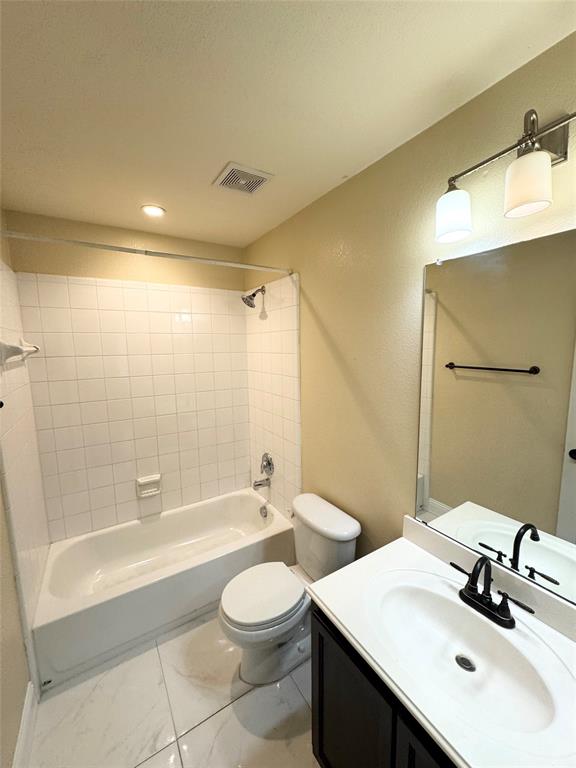 1111 Mount Olive Lane Forney, TX 75126 - Photo 13 of 15 a bathroom with a sink a toilet and shower