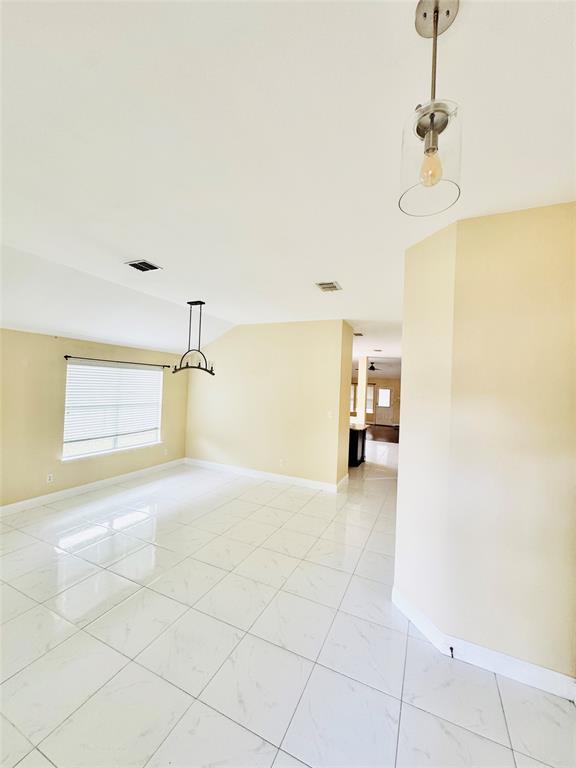 1111 Mount Olive Lane Forney, TX 75126 - Photo 3 of 15 a view of a livingroom with wooden floor and a ceiling fan