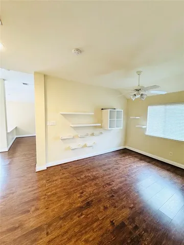 an empty room with a empty space and windows