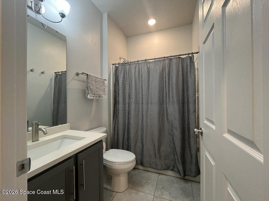 2359 Bonnyton Lane Palm Bay, FL 32907 - Photo 12 of 15 a bathroom with a granite countertop sink toilet and shower