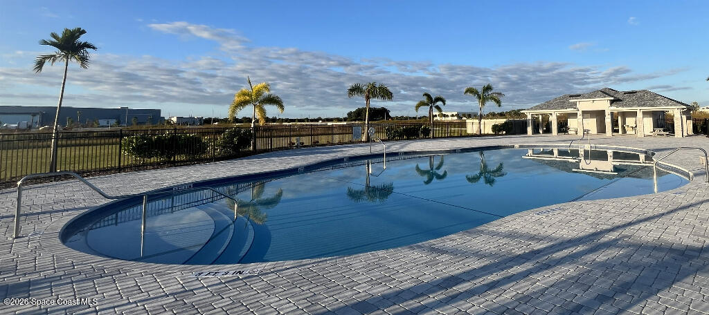 2359 Bonnyton Lane Palm Bay, FL 32907 - Photo 2 of 15 a view of a swimming pool with a lounge chair