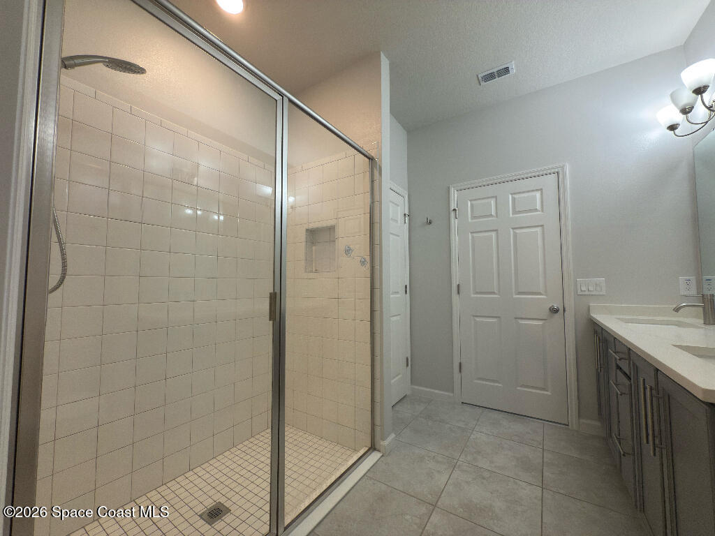 2359 Bonnyton Lane Palm Bay, FL 32907 - Photo 8 of 15 a bathroom with a shower and a sink