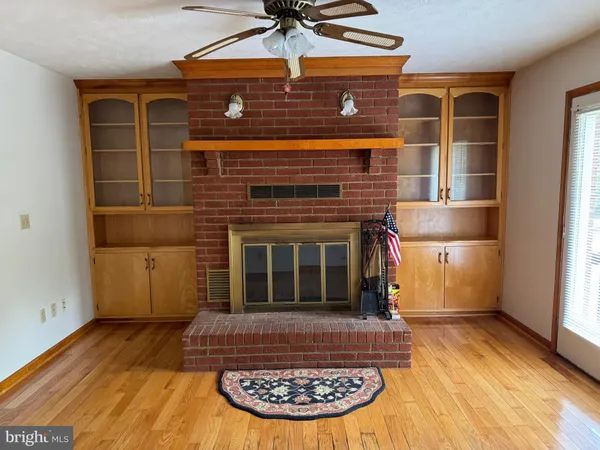 a view of a fireplace with wooden floor