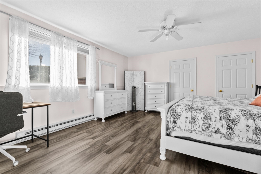 3 Dailey Street, Unit B Attleboro, MA 02703 - Photo 13 of 30 a spacious bedroom with a bed and a table in it