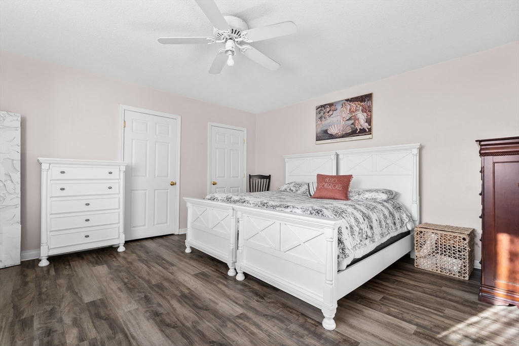 3 Dailey Street, Unit B Attleboro, MA 02703 - Photo 14 of 30 a bedroom with a large bed and a ceiling fan