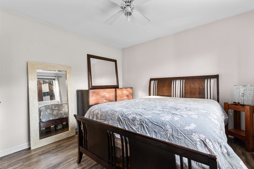 3 Dailey Street, Unit B Attleboro, MA 02703 - Photo 18 of 30 a bedroom with a bed and a chandelier
