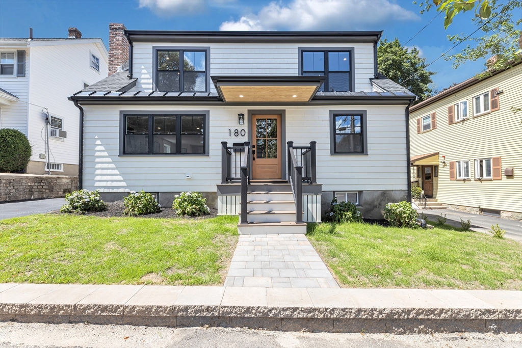 180 Dent Street Boston, MA 02132 - Photo 1 of 30 a front view of a house with a yard